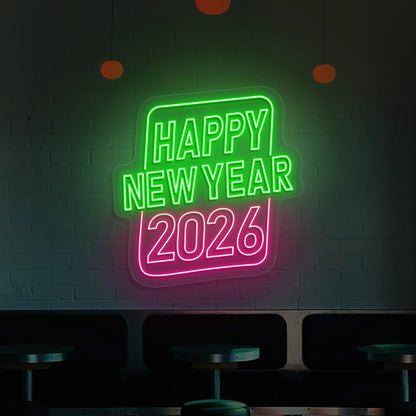 Neon sign reading Happy New Year 2026 in green and pink lights on a brick wall 