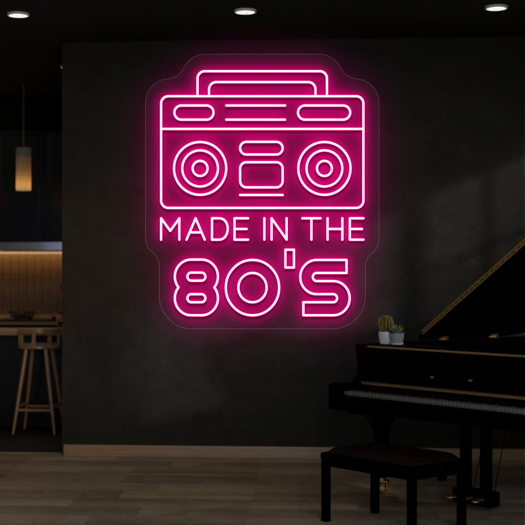 pink made in the 80s stereo vintage neon sign mounted on a wall