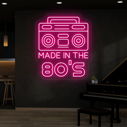 pink made in the 80s stereo vintage neon sign mounted on a wall