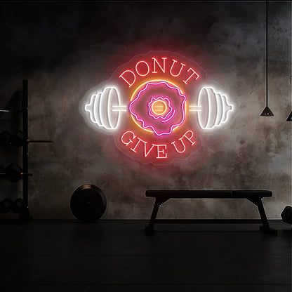 multi color donut give up gym neon sign mounted on a wall  