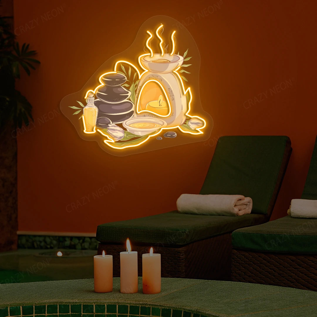 Spa Stones & Aromatherapy Neon Artwork lighting up in orange color on a spa wall
