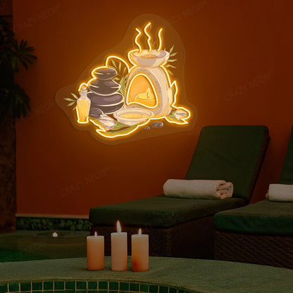 Spa Stones & Aromatherapy Neon Artwork lighting up in orange color on a spa wall