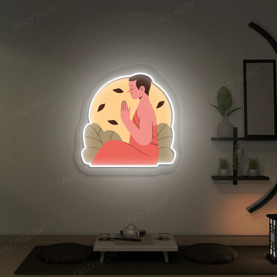 Serene Monk Neon Artwork lighting up in white color in a yoga room
