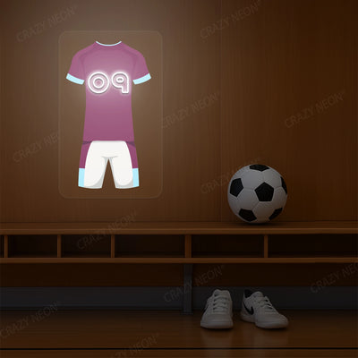 Claret and sky blue football jersey neon artwork with number 09 glowing on a wooden wall