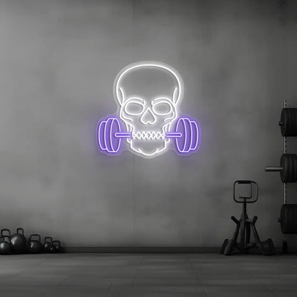 purple and white skull barbell gym neon sign mounted on a wall