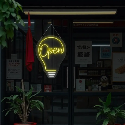 yellow bulb open neon sign hanging on a window