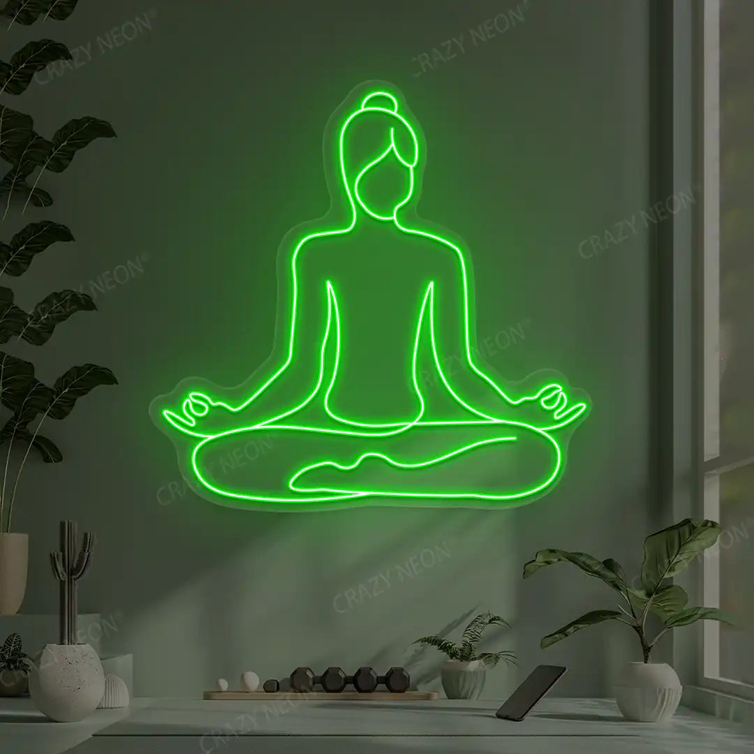 Swastikasana Contour Yoga Neon Sign lighting up in green color in a yoga room