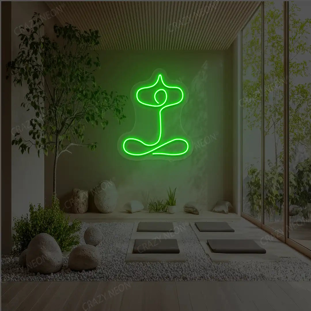 Sukhasana With Arms Raised Contour Yoga Neon Sign glowing in green color in a yoga room