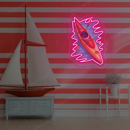 pink floating kayak neon artwork mounted on a wall