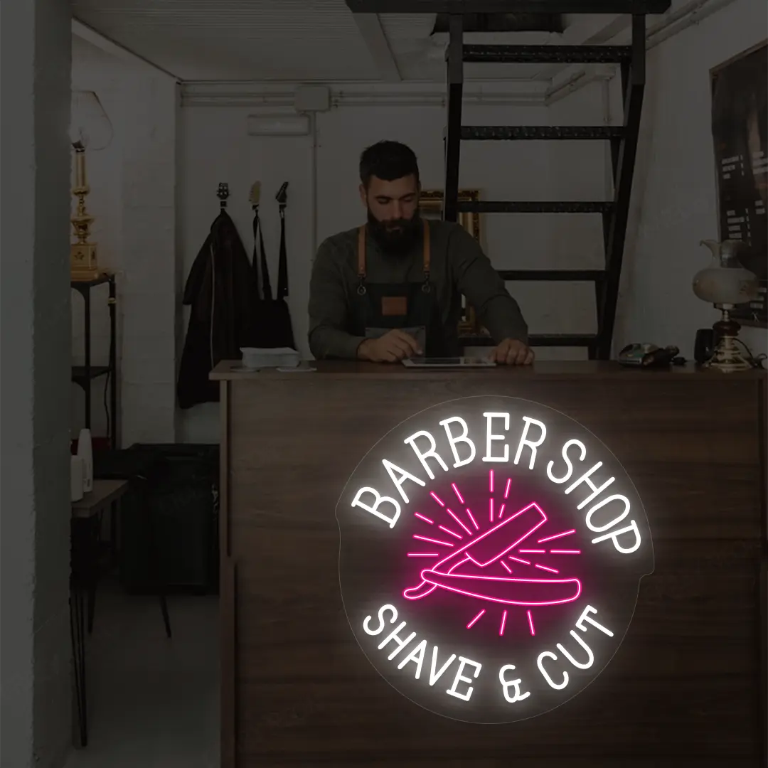 Barber Shop Shave & Cut Neon Sign in White and Pink Colour mounted on wall