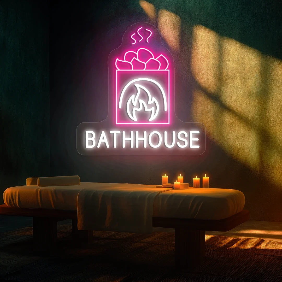FireStone Bathhouse neon sign in white and pink colors glowing in a spa room