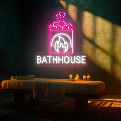 FireStone Bathhouse neon sign in white and pink colors glowing in a spa room