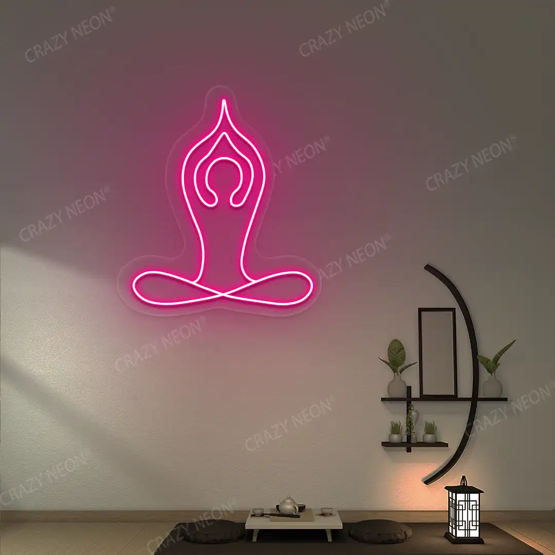 Padmasana With Raised Arms Yoga Neon Sign lighting up in pink color in a yoga room