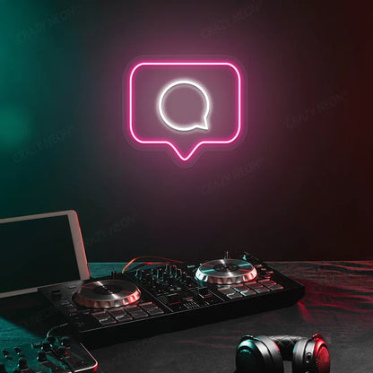Comment Box Neon Sign in Pink Color Mounted on a wall 