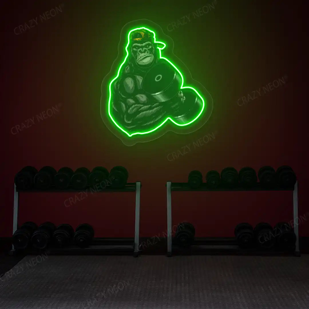 green gorilla dumbbell lifting gym neon artwork mounted on a wall