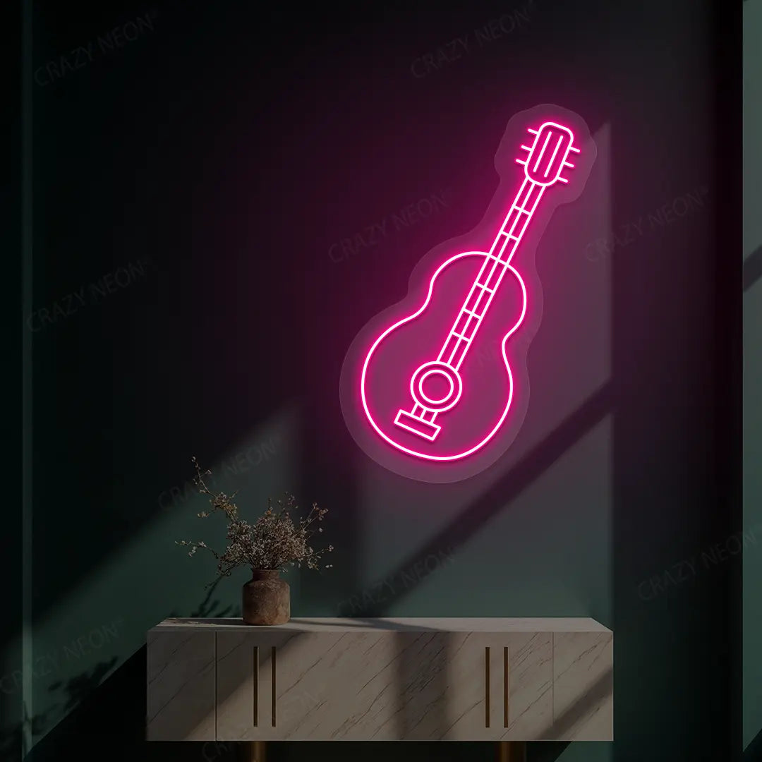 pink acoustic guitar neon sign mounted on a wall