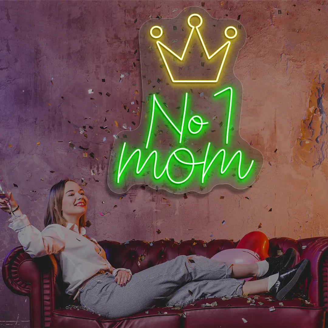green and yellow no 1 mom crown neon sign mounted on a wall