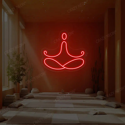 Padmasana Yoga Neon Sign lighting up in red color in a yoga room