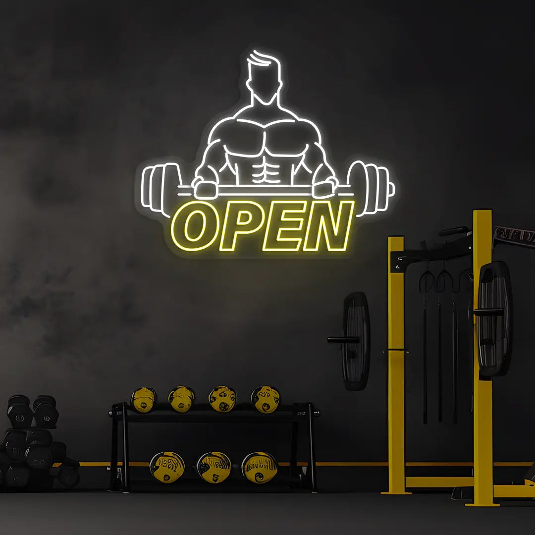 yellow and white open gym bodybuilder neon sign mounted on a wall