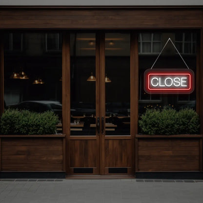 horizontal close neon sign glowing in red color on a window