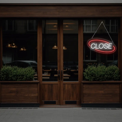 red semi oval close neon sign hanging on a window