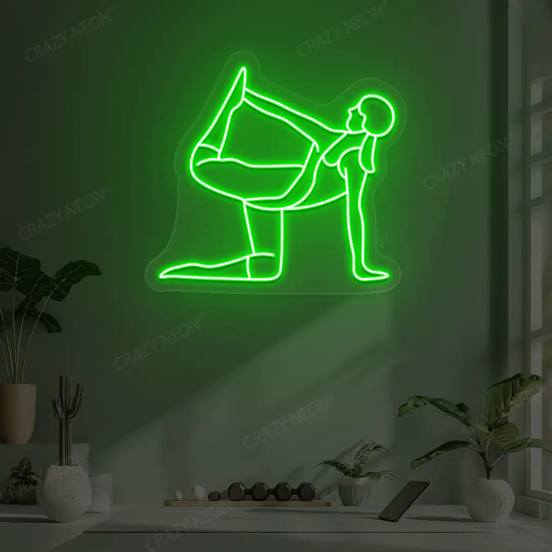 Ardha Dhanurasana Yoga Neon Sign glowing in green color in a yoga room