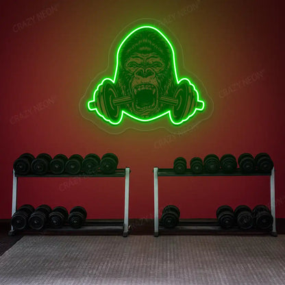 green gorilla barbell gym neon artwork mounted on a wall