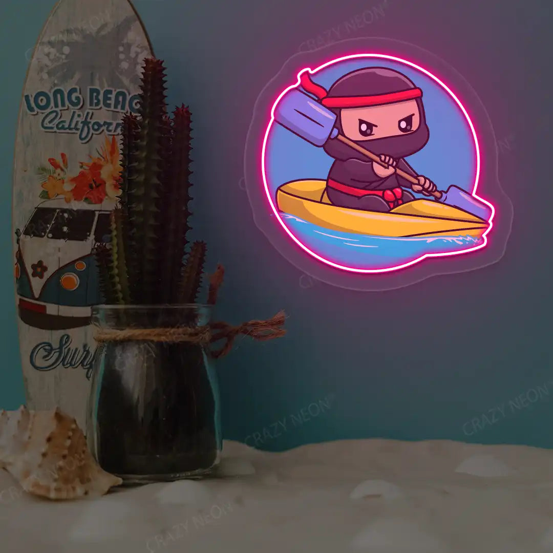 pink ninja kayaking neon artwork mounted on a wall
