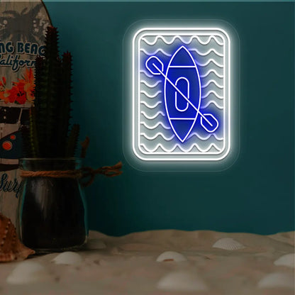 blue and white kayak ocean waves neon sign mounted on a wall