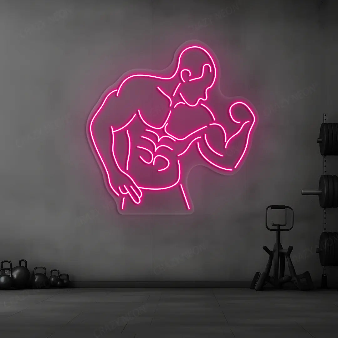 pink muscle man flex neon sign mounted on a wall