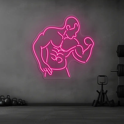 pink muscle man flex neon sign mounted on a wall