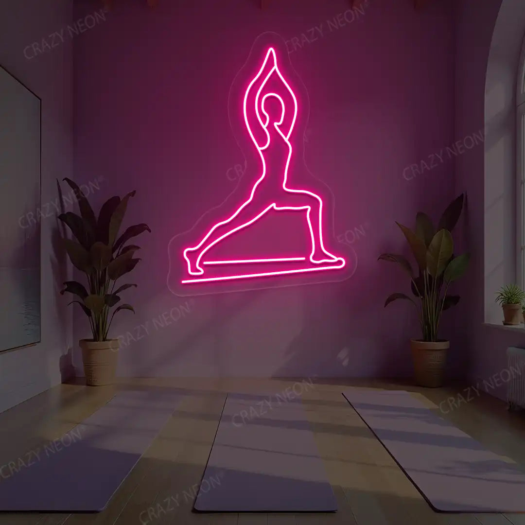 Virabhadrasana I Yoga Neon Sign lighting up in pink color in a yoga room