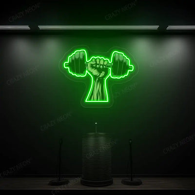 green hand lifting dumbbell gym neon artwork mounted on a wall