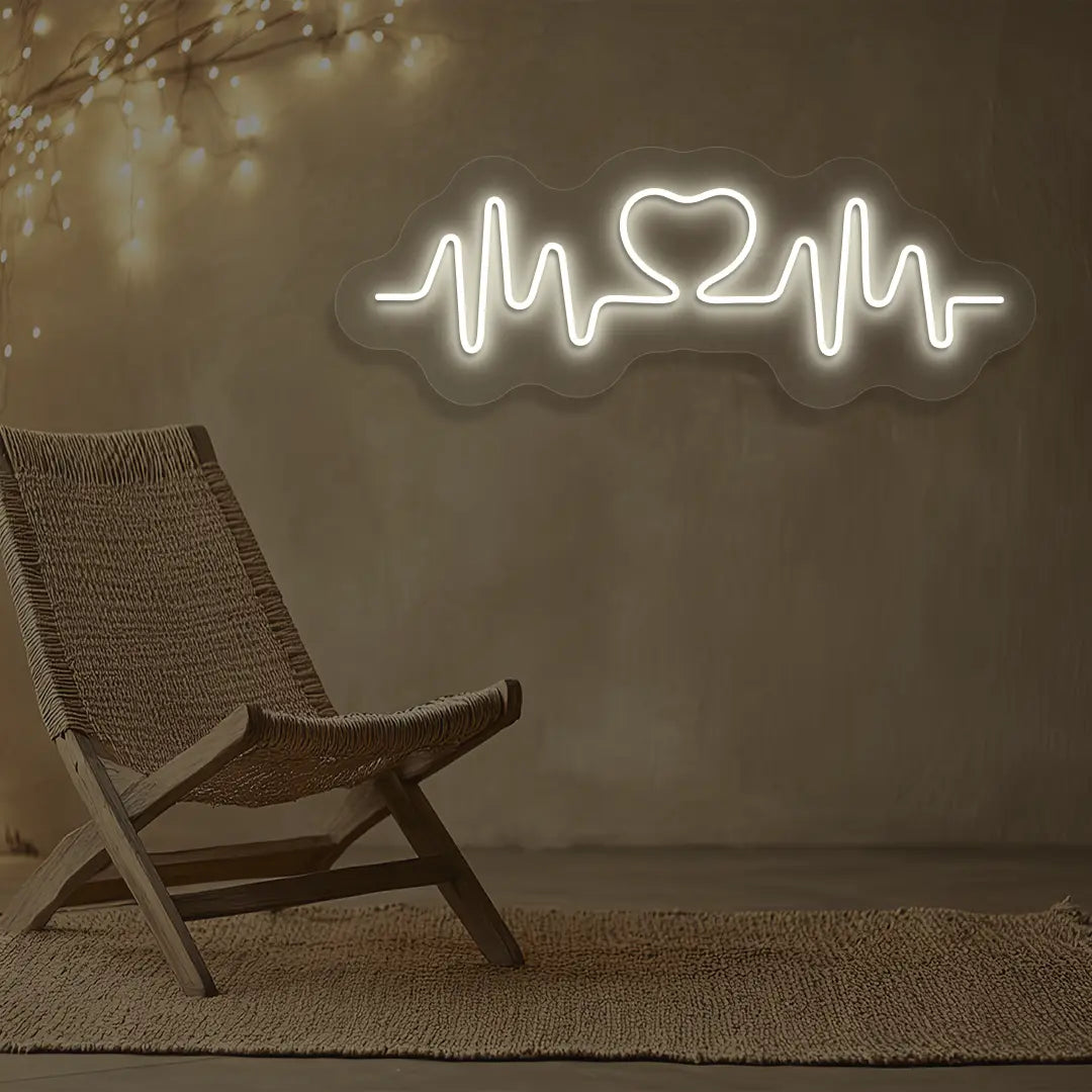 warm white love pulse neon sign mounted on a wall