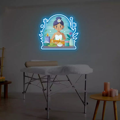Spa Girl Neon Artwork lighting up in ice blue color on a spa wall