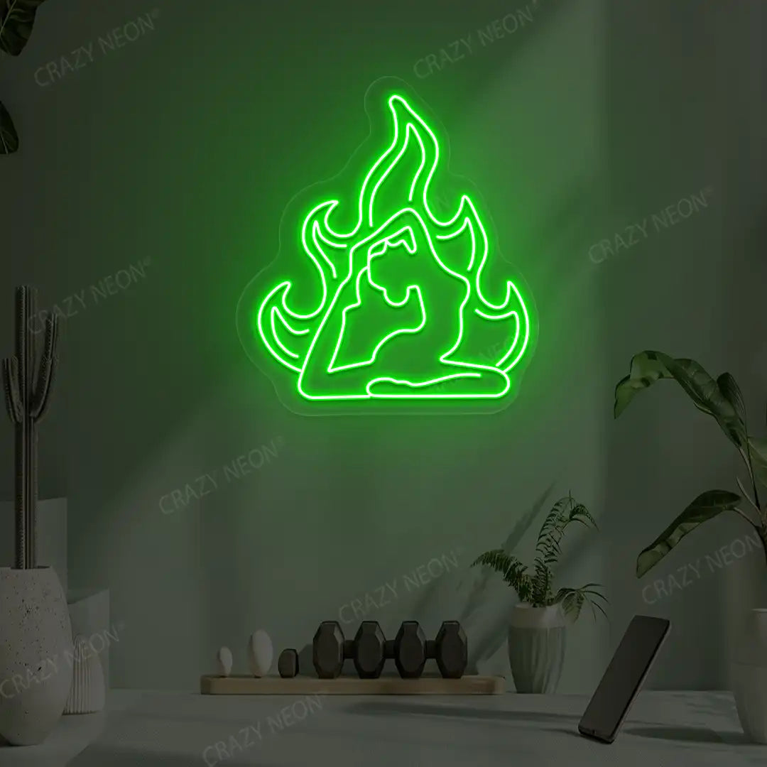Flamed Eka Pada Rajakapotasana Yoga Neon Sign lighting up in green color in a yoga room