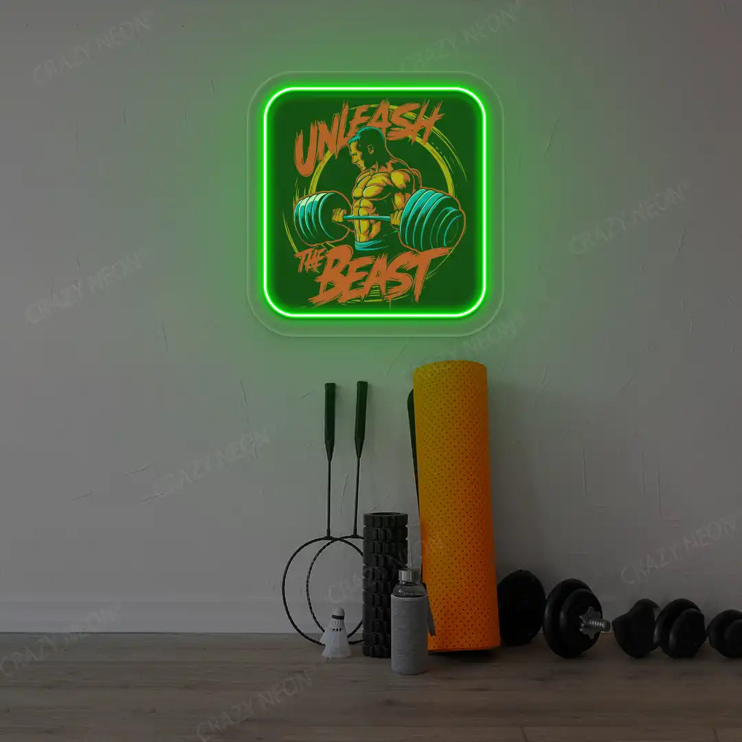 green unleash the beast gym neon artwork mounted on a wall