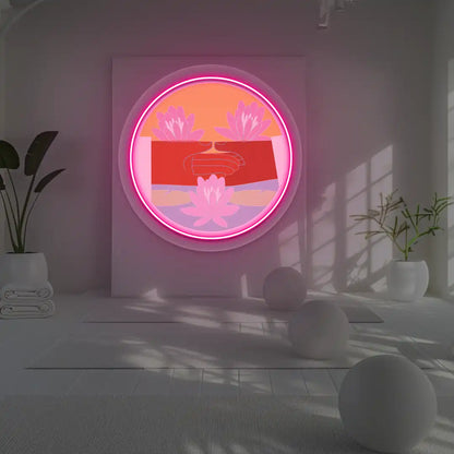 Dhyana Mudra Lotus Neon Artwork lighting up in pink color in a yoga room