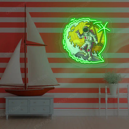 green astronaut surfing neon artwork mounted on a wall