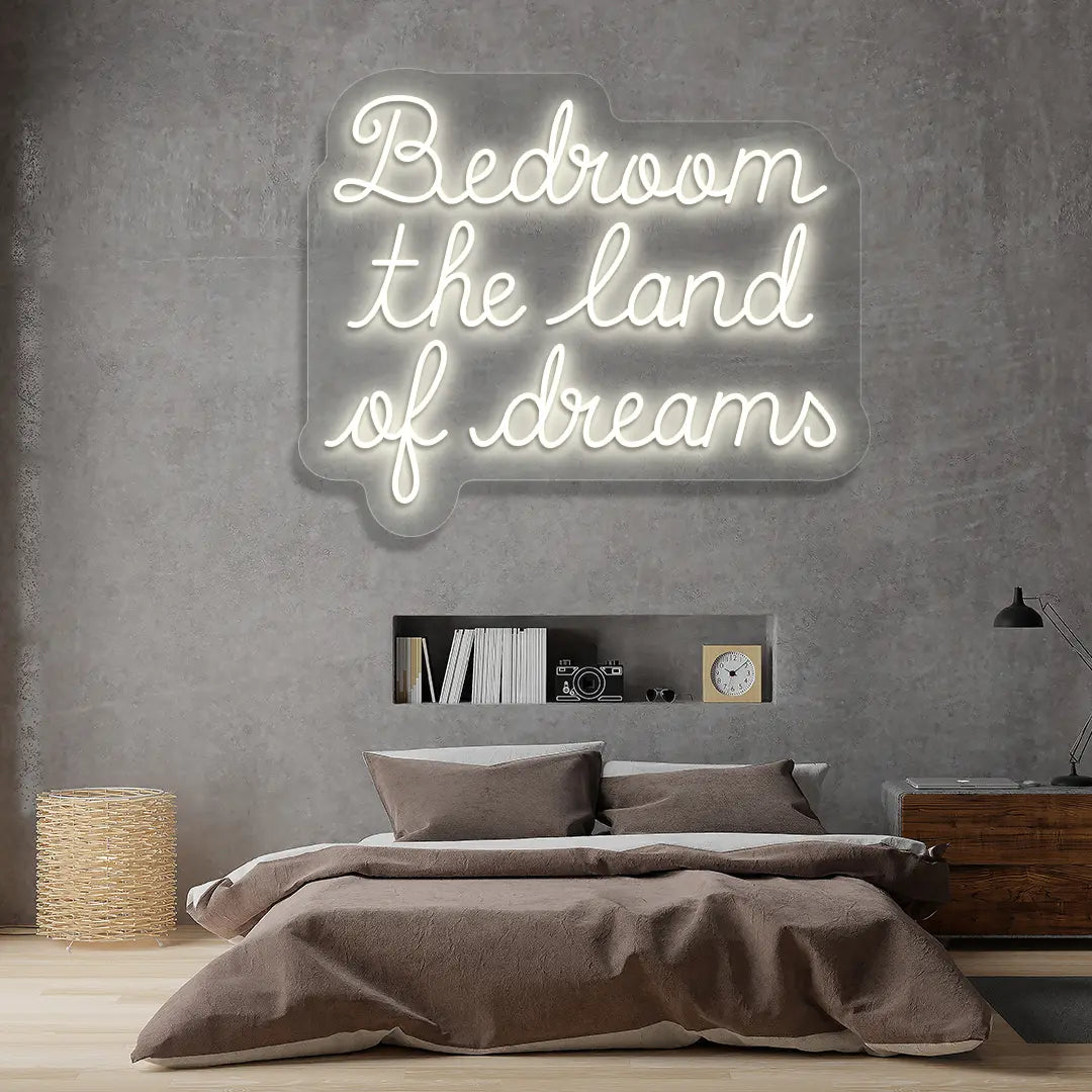 warm white bedroom the land of dreams neon sign mounted on a wall