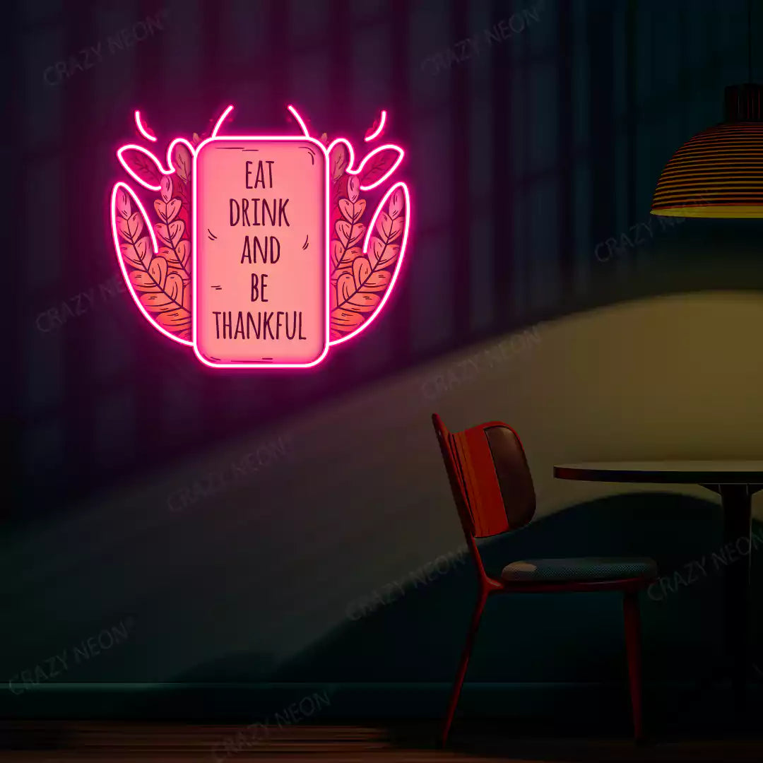Eat drink and be thankful neon sign in pink
