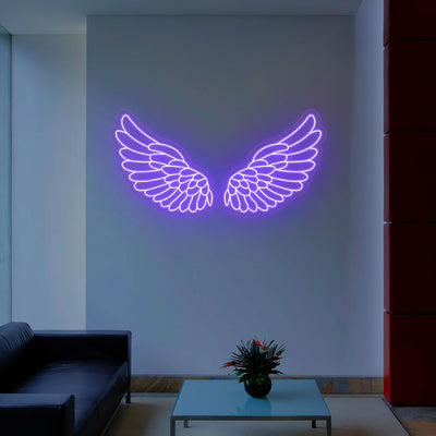 purple archangel wings neon sign mounted on a wall