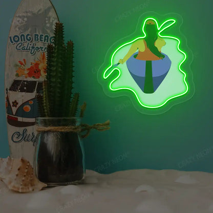 green woman kayaking neon artwork mounted on a wall