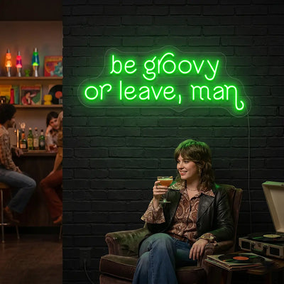 green be groovy or leave, man vintage neon sign mounted on a wall