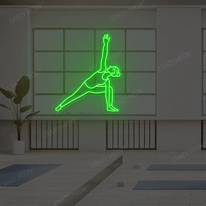 Utthita Parsvakonasana Yoga Neon Sign lighting up in green color in a yoga room