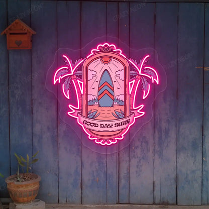 pink good day surf beach neon artwork mounted on a wall