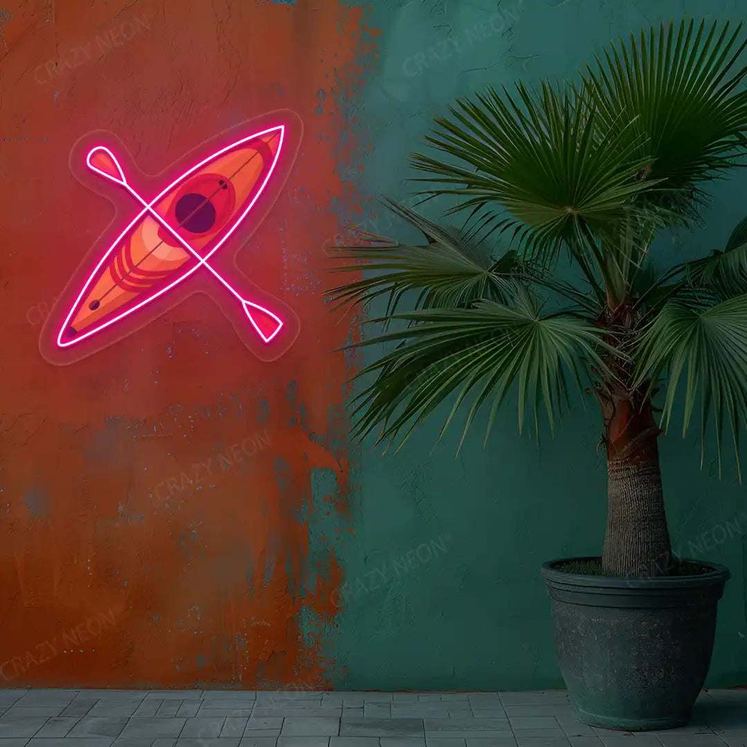 pink kayak boat neon artwork mounted on a wall