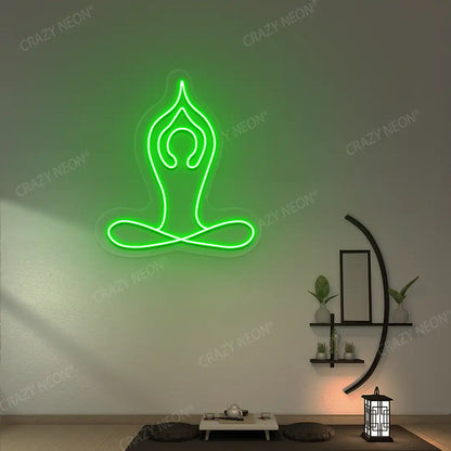 Padmasana With Raised Arms Yoga Neon Sign lighting up in green color in a yoga room