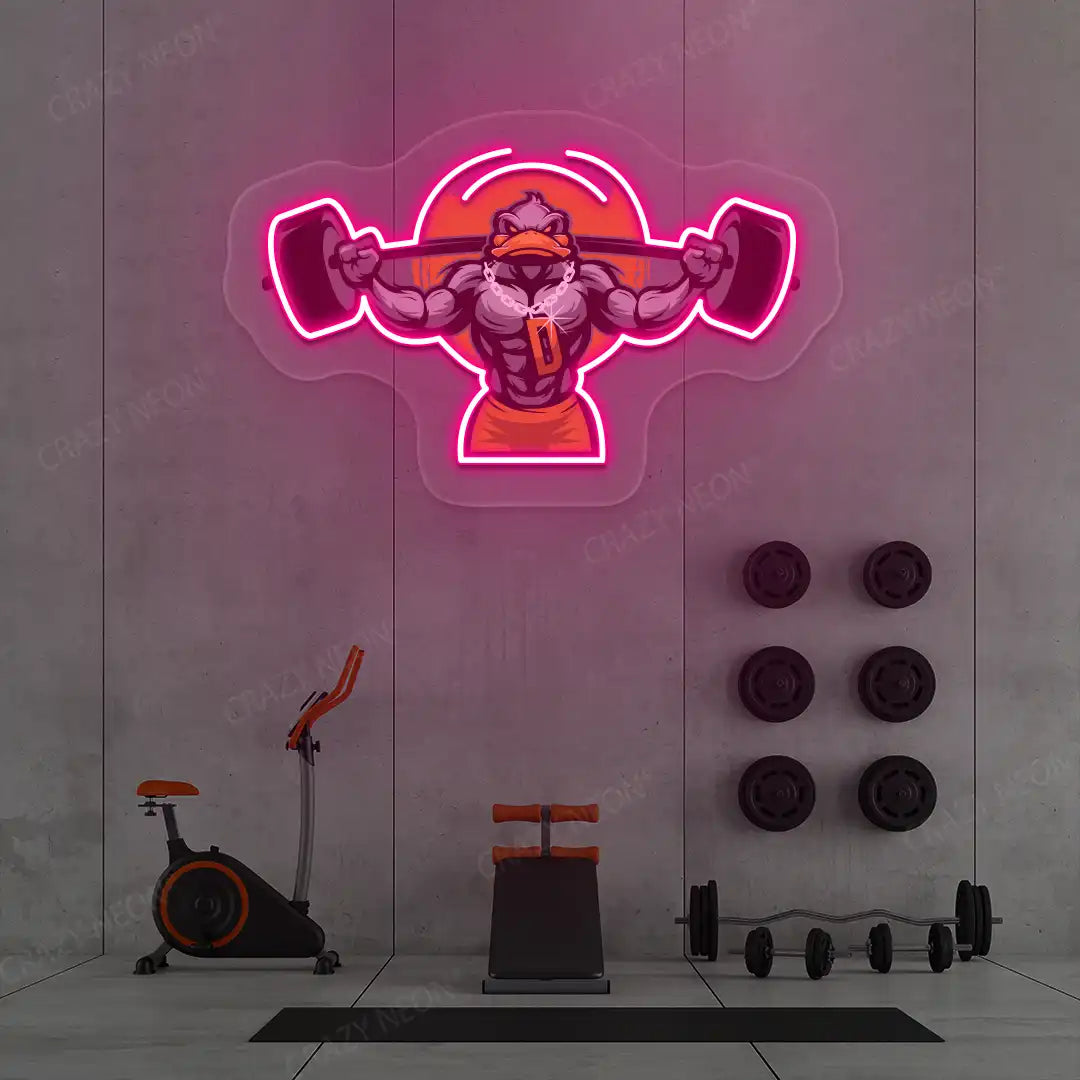 pink muscular duck powerlifting gym neon artwork mounted on a wall
