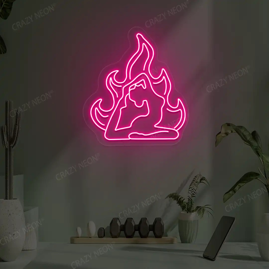 Flamed Eka Pada Rajakapotasana Yoga Neon Sign lighting up in pink color in a yoga room